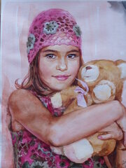 A girl with a teddy bear